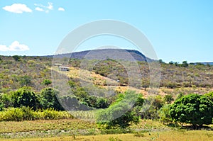 Isolated house in the backlands of Bahia in Brazil with mountains and local vegetation