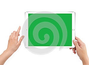 Isolated human right hand holding green screen white tablet computer