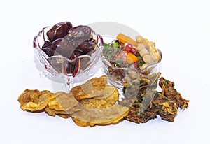 Isolated Iftar Set of Basin pakoda or pakora, chola chana and dates Popular Islamic food on white background