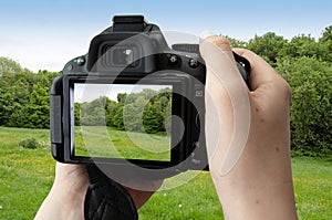 Isolated image of hands holding digital camera