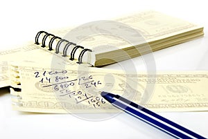 Isolated image of a notebook and pen close-up