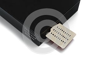 Isolated image of satellite television smart card inserting into the decoder