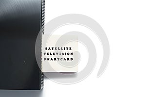 Isolated image of satellite television smart card inserting into the decoder