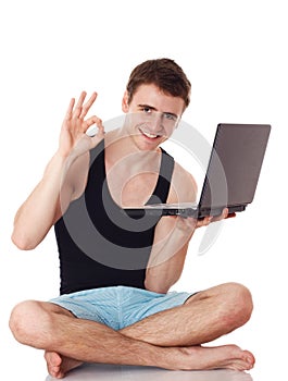 Isolated image of a young man with his laptop.