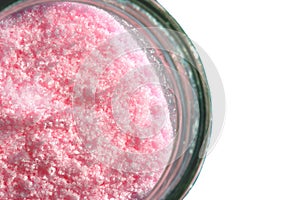 Isolated jar of pink curing salt