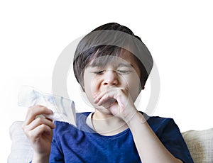 Isolated Kid sneezing after using tissue wiped his nose,A boy suffering from running nose or sneezing,Childhood wiping nose and