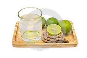 Isolated lemonade with fresh green lemons