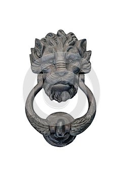 Isolated lion head, door knocker on the entrance of a house, Malta. Italian traditional doorknob on white background. Old ornate