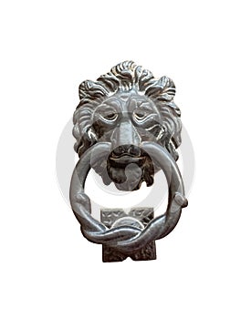 Isolated lion head with a ring on its mouth, door knocker on the entrance of a house, Malta. Italian traditional doorknob on white