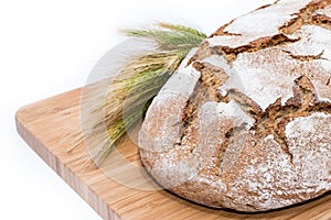 Isolated Loaf of bread on cutting board