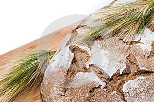 Isolated Loaf of bread on cutting board