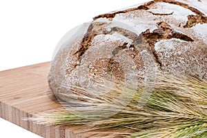 Isolated Loaf of bread on cutting board