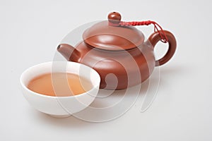 Isolated macro shot tea pot and tea cup