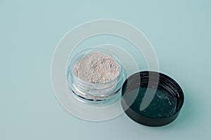 Isolated makeup beauty cosmetics, facial product. Mineral powder. Macro photo.