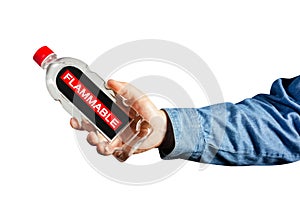 Isolated male hand in shirt holding flammable liquid bottle