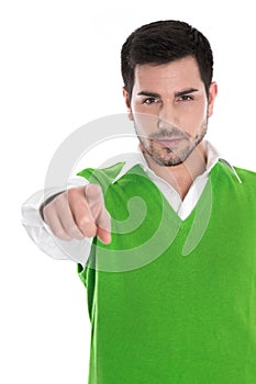 Isolated man in a green shirt pointing with his forefinger