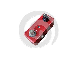 Isolated metallic red true bypass reverb stompbox electric guitar effect for studio and stage performed on white background photo