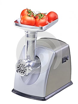 Isolated mincer with tomatoes photo