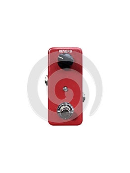 Isolated mini boutique red and black knob reverb stomp box electric guitar effect on white background. photo