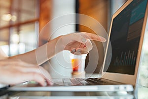 Isolated mockup image of laptop and female hand pointing finger to laptop screen have a screen chart
