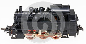 Isolated model of old train locomotive. Antique toy hobby collection. Single isolated locomotive.