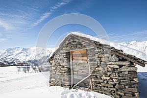 Isolated mountain hut in the snow