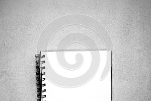 isolated notebook on wood background have copy space for put text, monochrome style, black and white color