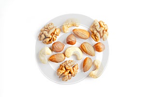 Isolated nuts pattern background. Walnut, cashew, almond and hazelnut on white background. View from above
