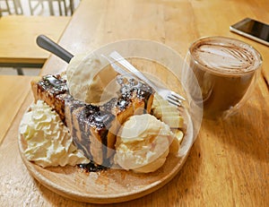 Isolated object, Brownie bread toast with ice cream banana and chocolate icing topping with flare light background