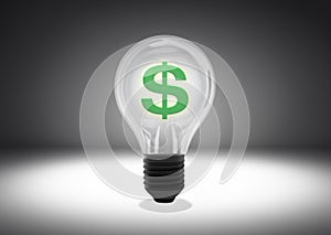 Isolated object shot of a light bulb with green dollar sign inside on a dark background