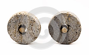 Isolated object shot of two stone wheels with wooden axles, the first invention made by a caveman.