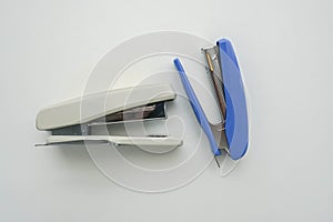 Isolated office stationary of big blue and white stapler in workplace for business documents