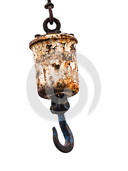 Isolated old rusty crane hook with exfoliated paint on bright background.
