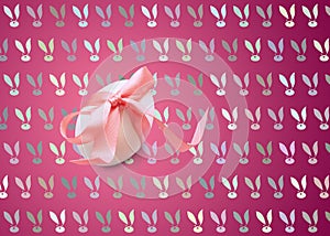 Isolated one easter white egg with pink ribbon on a burgundy background with a pattern of Bunny rabbit muzzles.