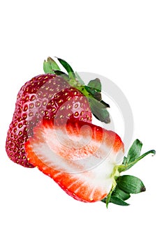 Isolated one and half Strawberries