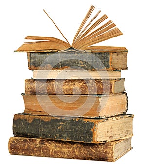 Isolated open book on top of old books stack