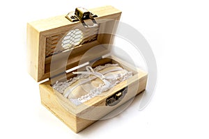 Isolated open wooden jewelry box for rings on white background wedding celebration