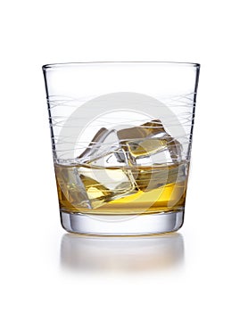 A isolated ornate tumbler style glass of whisky and ice, shot on white