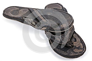 Isolated Pair of Old Worn-Out Black Sandals