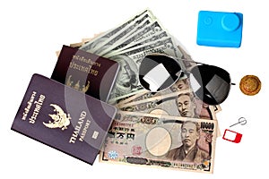 Isolated of passport ,eye glasss,small relax hat ,action camera and mobile socket sim place on banknote for the time of relaxation