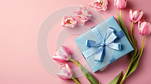 An isolated pastel pink background with black copyspace is the background for this Mother's Day decorations concept