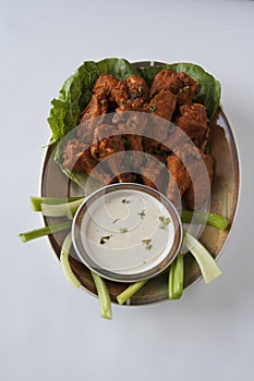 Isolated photo of chicken buffalo wings and dip