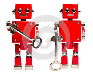 Isolated photo of red toy robot with key