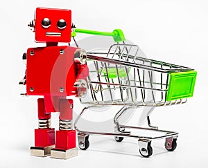 Isolated photo of red toy robot with shopping cart