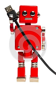 Isolated photo of red toy robot with usb cable