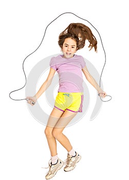 Isolated photo of smiling girl jumping with skipping rope