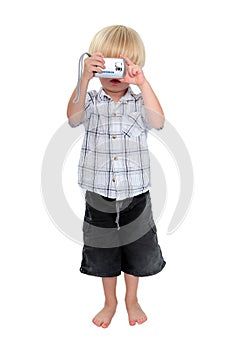 Isolated photo of young boy taking a photograph