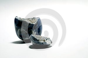 Isolated picture of broken lucky stone on white background