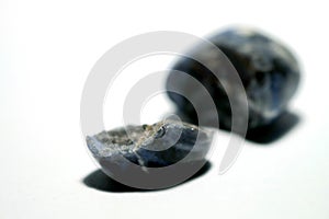 Isolated picture of broken lucky stone on white background photo