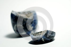 Isolated picture of broken lucky stone on white background photo